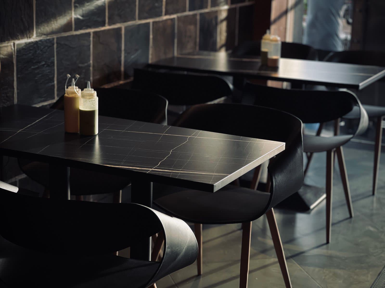Cafe with black stone tables